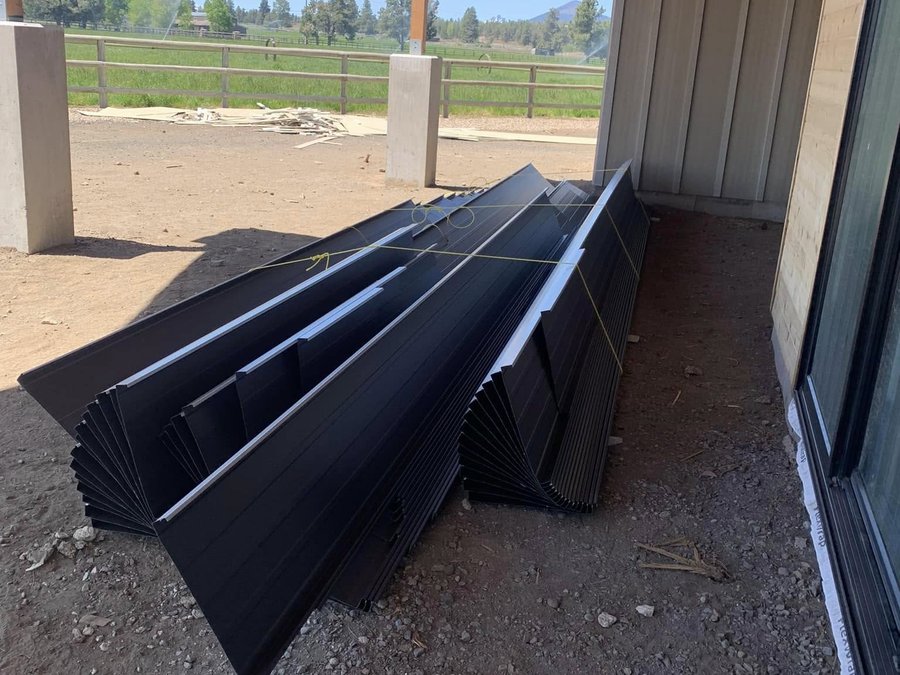 Dark grey panels staged under a covered patio